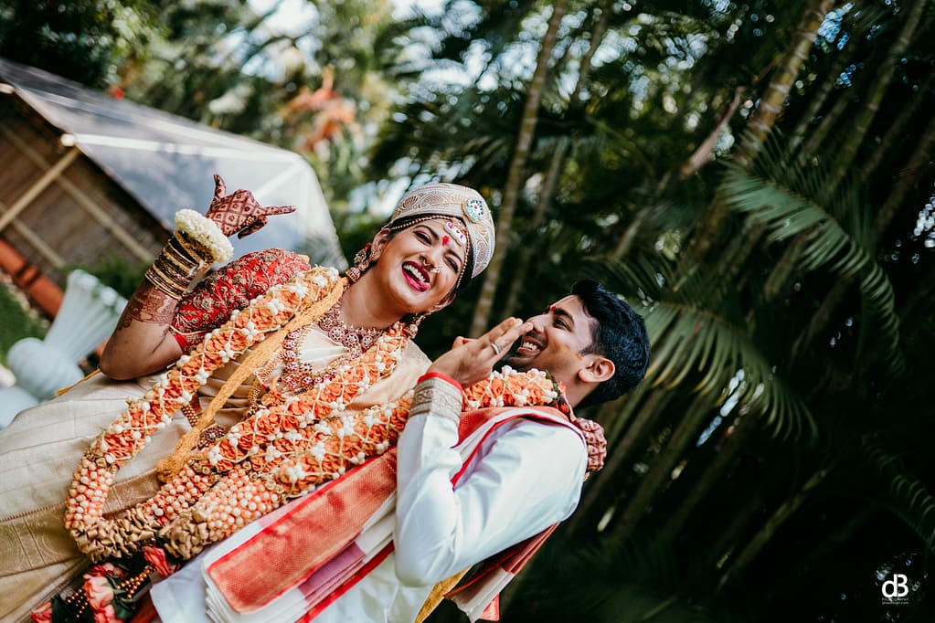 couple having fun while wedding photographer captures the best moments 
